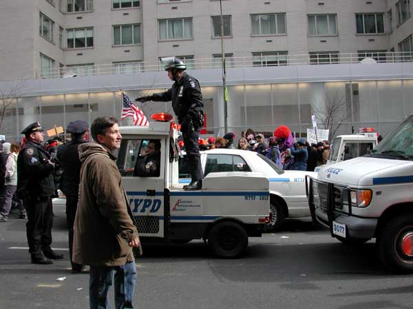 This cop was riding on the back of this teeny little cop-mobile as it worked its way up 3rd avenue.