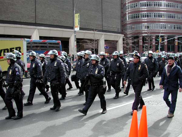 Cops marching up 3rd ave looking like a bunch of stormtroopers.