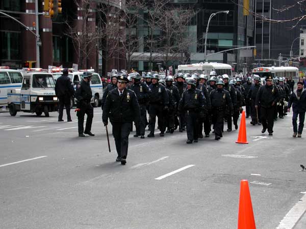 In riot gear, cops look scary. Even when they look like theyre on parade.