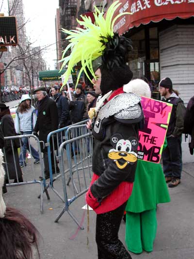 This guy is holding a sign that reads 